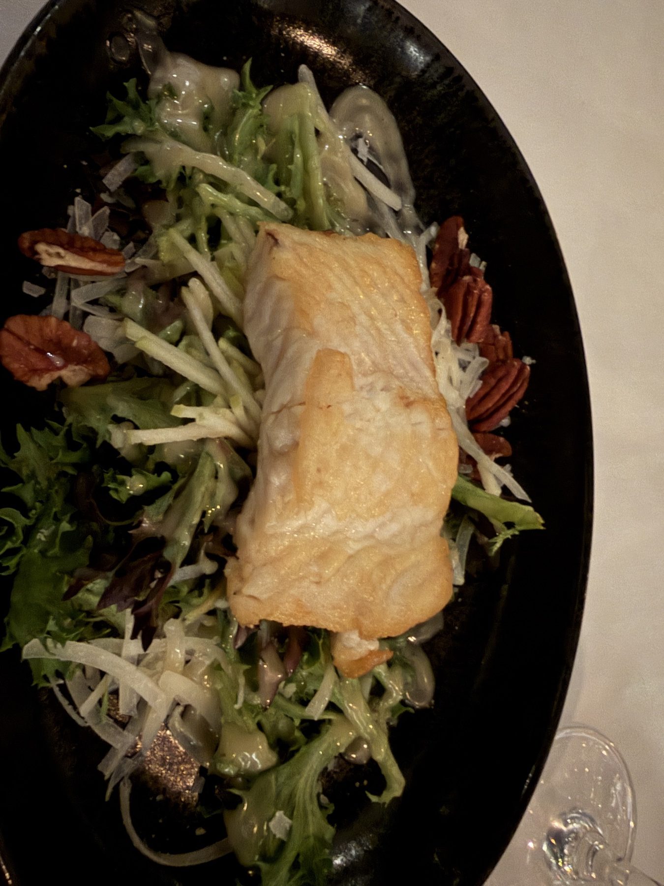 Cold-smoked sturgeon on greens with apple, pecans, and Pecorino